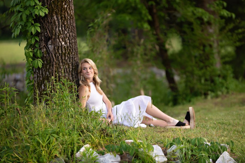 A high school senior session and young lady is sitting on the ground. Greenville, SC newborn photographer, Easley, SC Newborn photographer