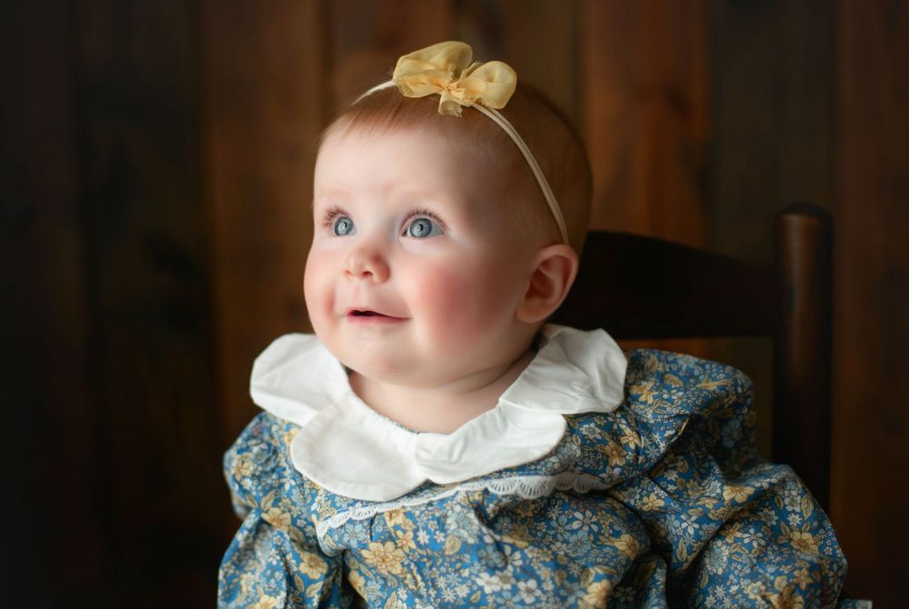 A sweet profile shot with little girl looking up and smiling. Greenville, SC newborn photographer, Easley, SC Newborn photographer