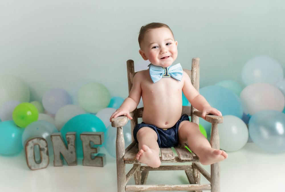 A smash the cake session with a little boy in a bowtie. Greenville, SC newborn photographer, Easley, SC Newborn photographer