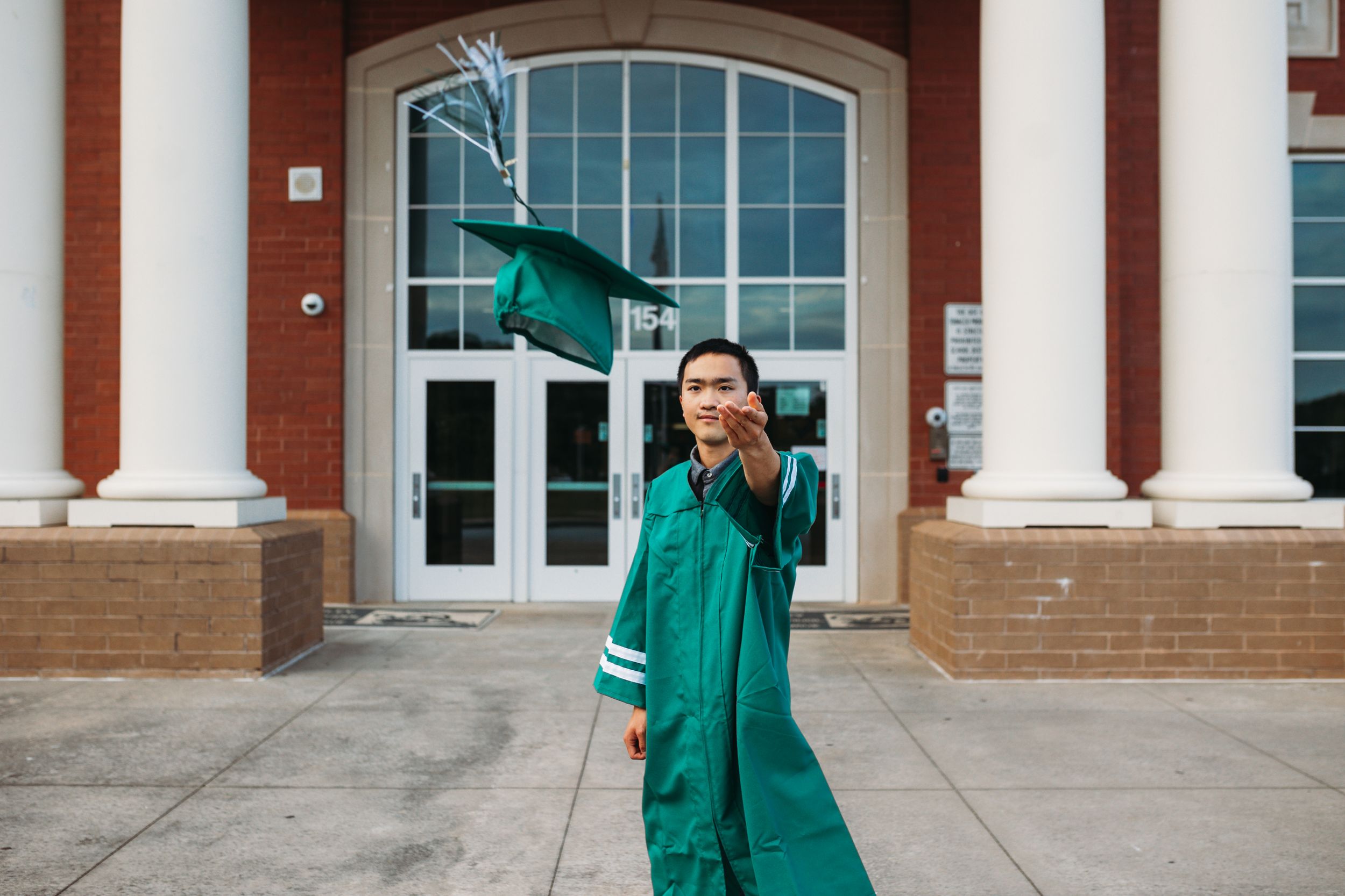 A senior session with the young man throwing his hat. Greenville, SC newborn photographer, Easley, SC Newborn photographer