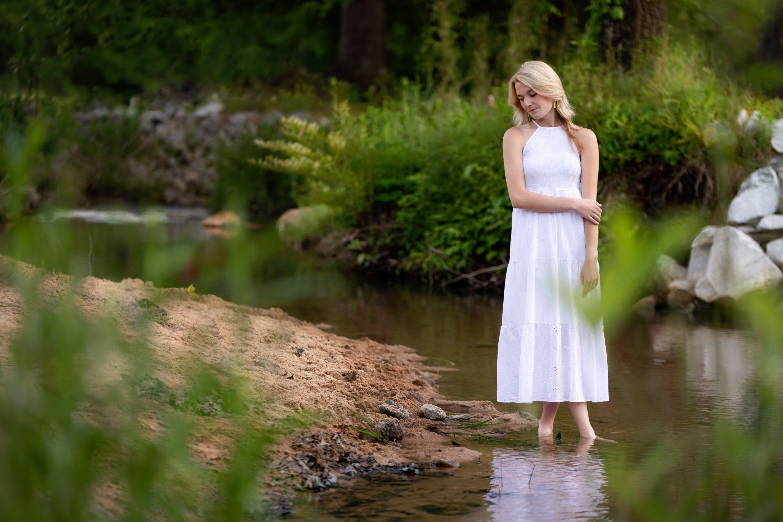 A Senior session with a lady standing by the water. Greenville, SC newborn photographer, Easley, SC Newborn photographer