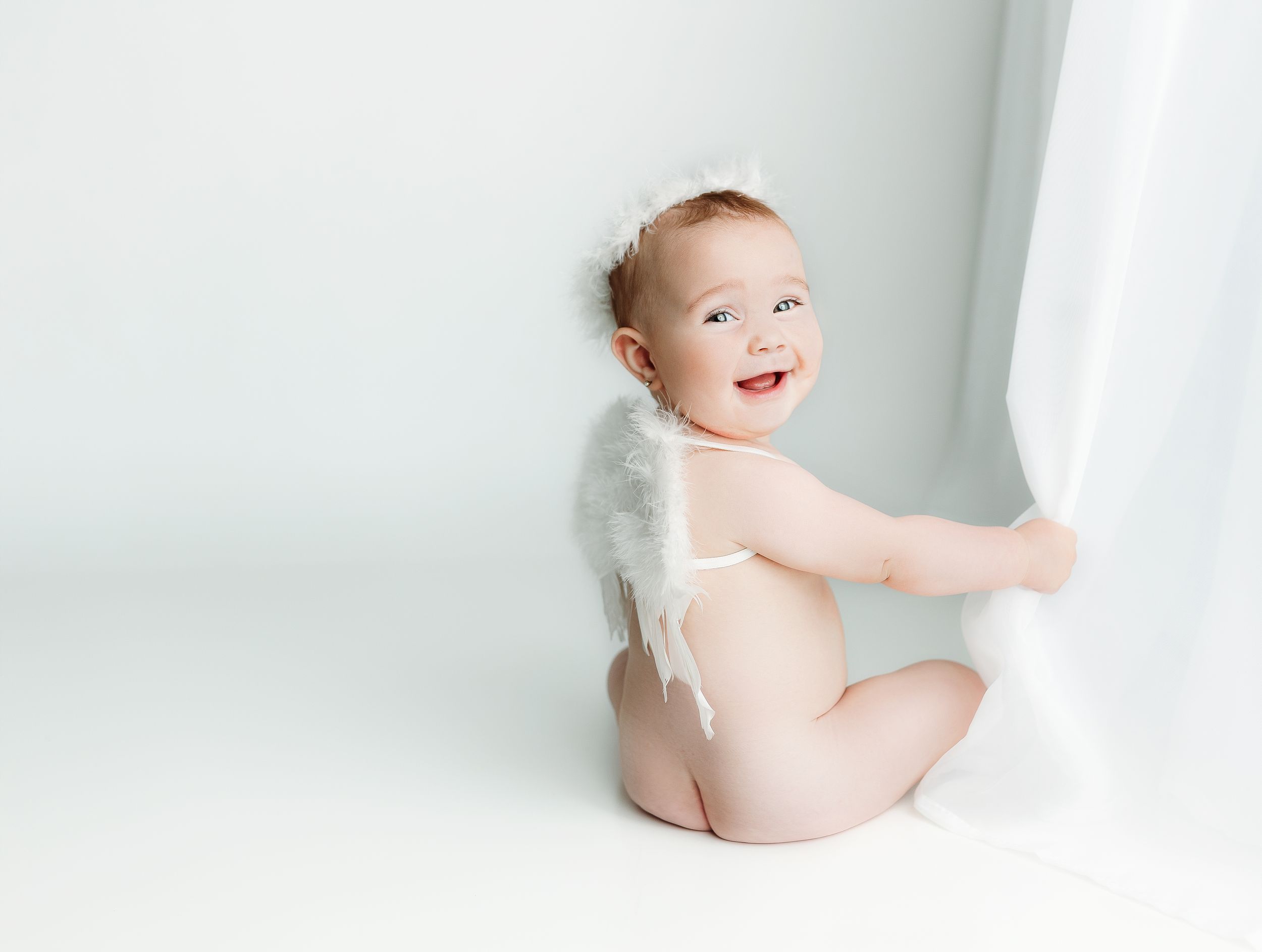 Milestone session with little girl wearing angel wings. Greenville, SC newborn photographer, Easley, SC Newborn photographer