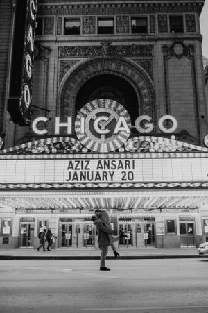 The iconic Chicago Theatre marquee lit up at night in black and white.