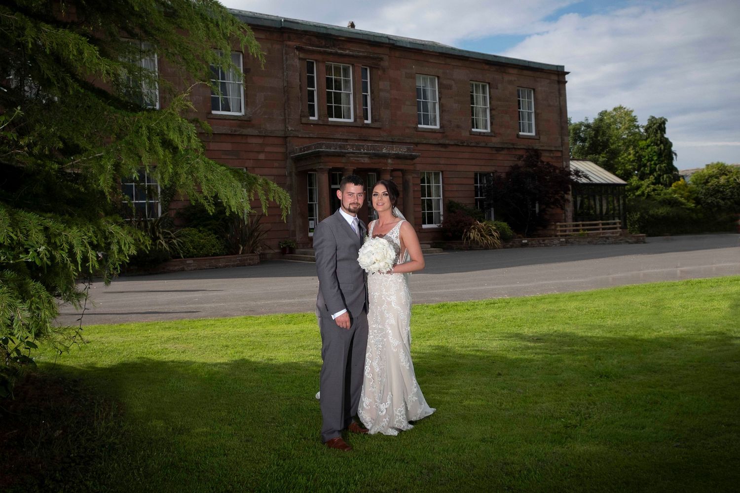 Liam & becky pose for their wedding photograph at greenhill hotel, Wigton.