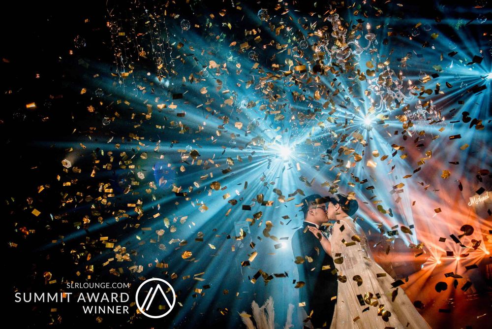 Abstract explosion of blue light and sparkles against dark background.