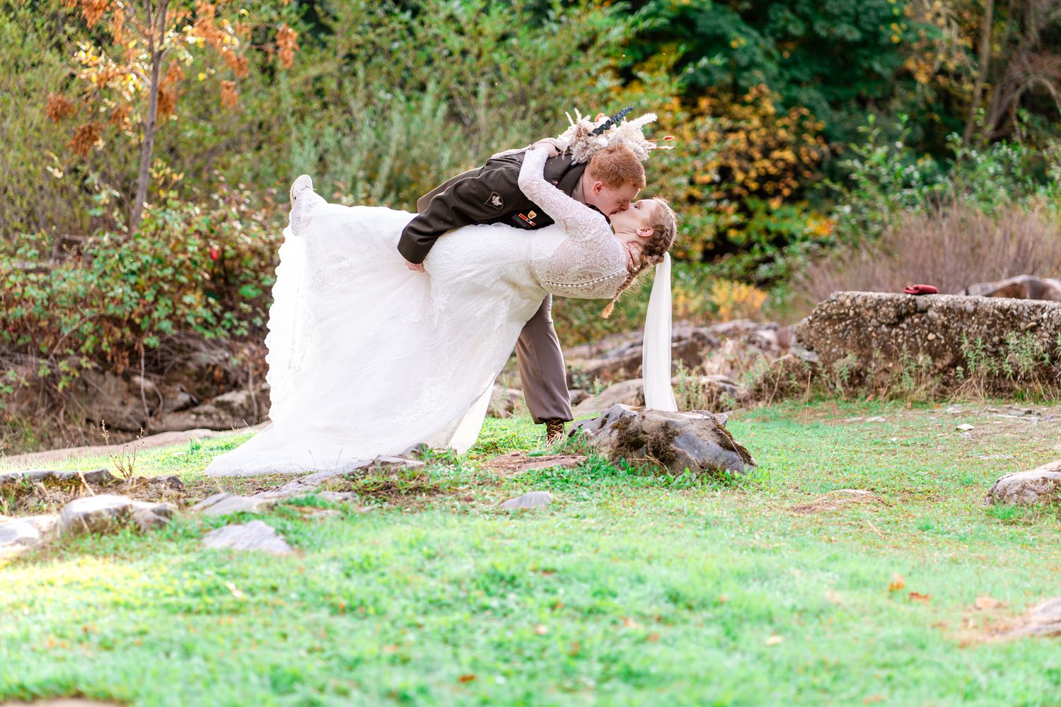 groom dips bride for a kiss