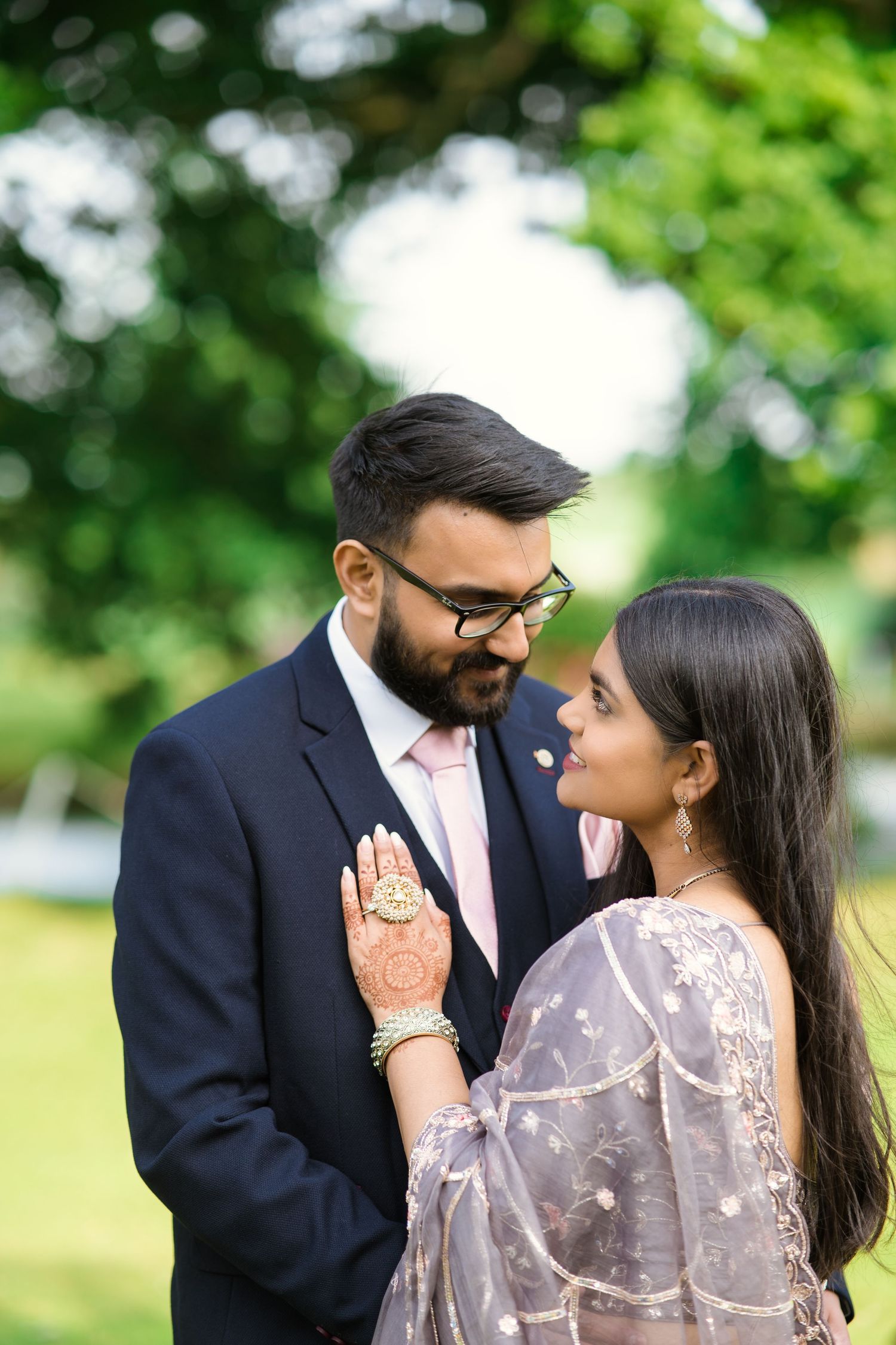 intimate newly weds holding each other showing their love towards the camera