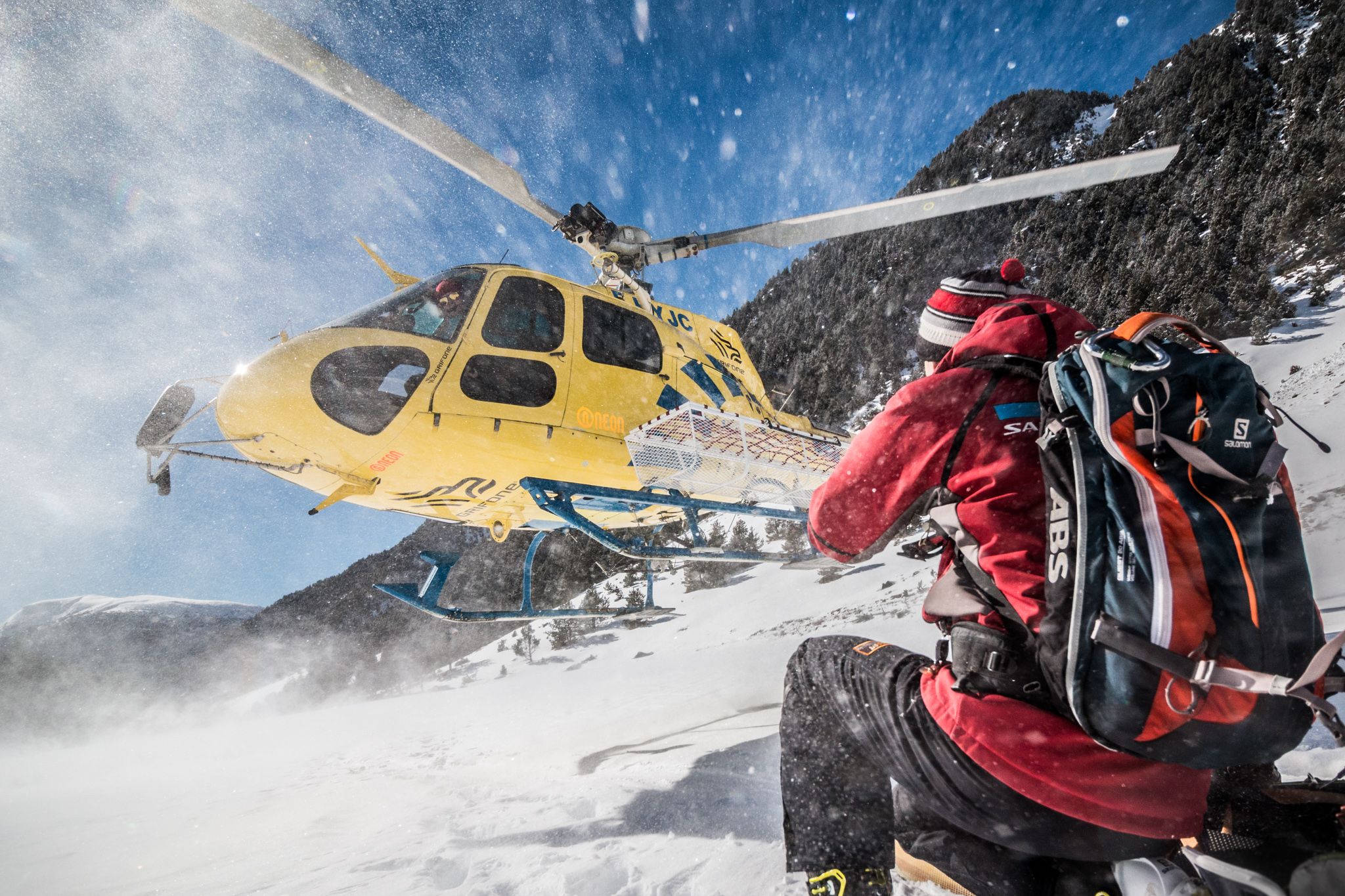 Helicopter taking off on snowy mountain