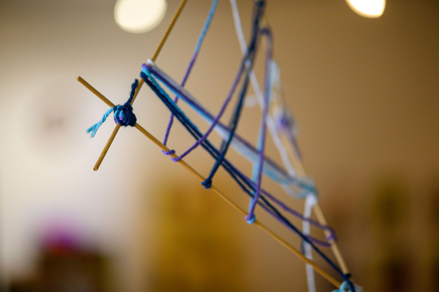 Abstract macro shot of blue strings forming geometric patterns.