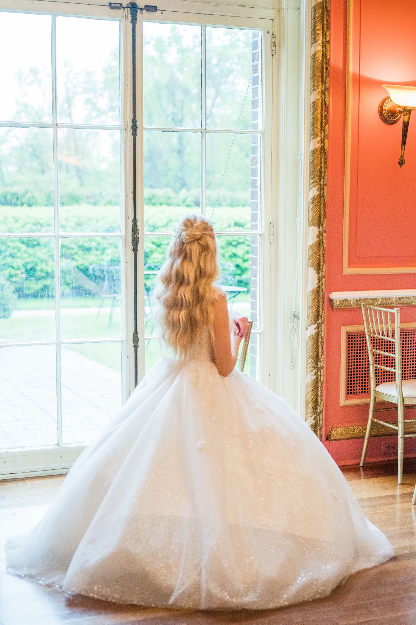 Flower girl looking out of the window
