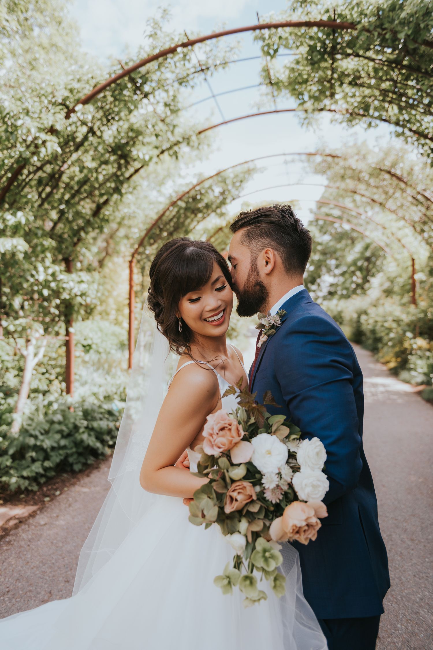 Stunning bride and groom during their garden wedding at Red Butte Gardens in Salt Lake City Utah.