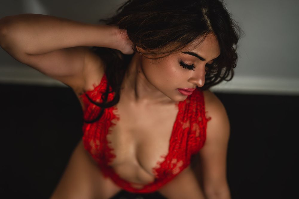 five year anniversary session for woman in red lingerie in studio boudoir session