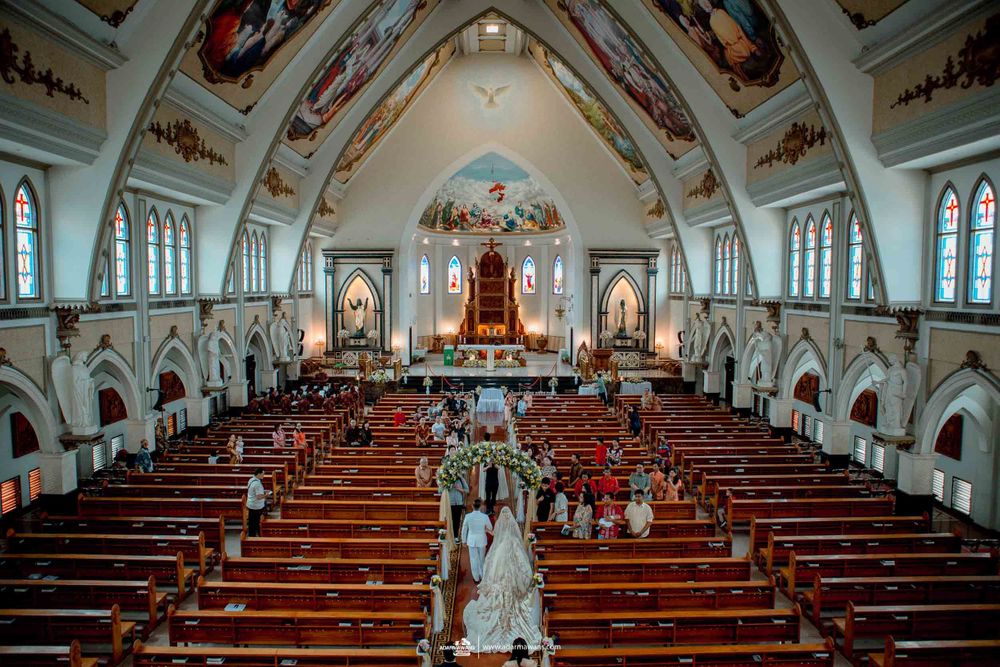 Aerial view of a traditional church wedding ceremony in an ornate cathedral.