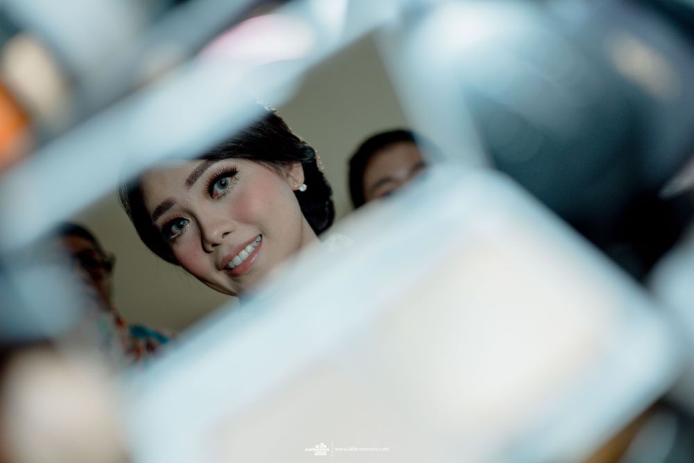 An artistic mirror reflection shot through geometric shapes.
