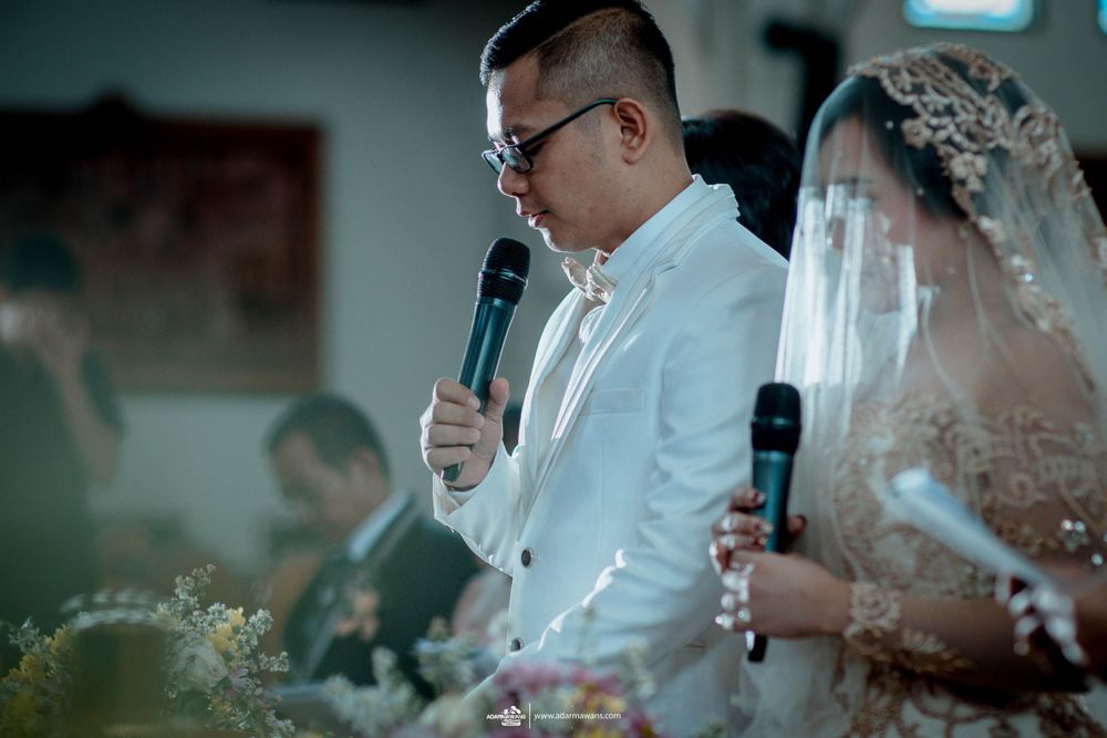 A wedding reception speech moment captured with soft focus and ambient lighting.
