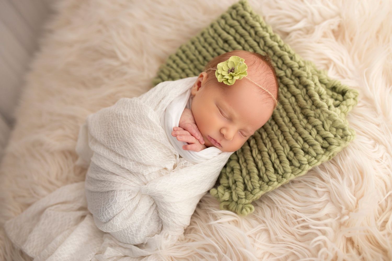Newborn baby swaddled, photographed at Little Wonderland Photography, Widnes, Cheshire