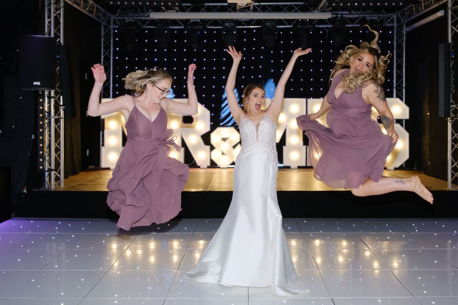 The Moorlands Wedding, Bride and Bridesmaids having fun on the dance floor at the Moorlands, Halifax. Halifax Wedding