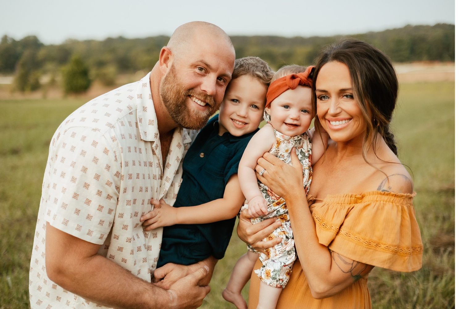 Family portrait session in coordinating yellow and white outfits.