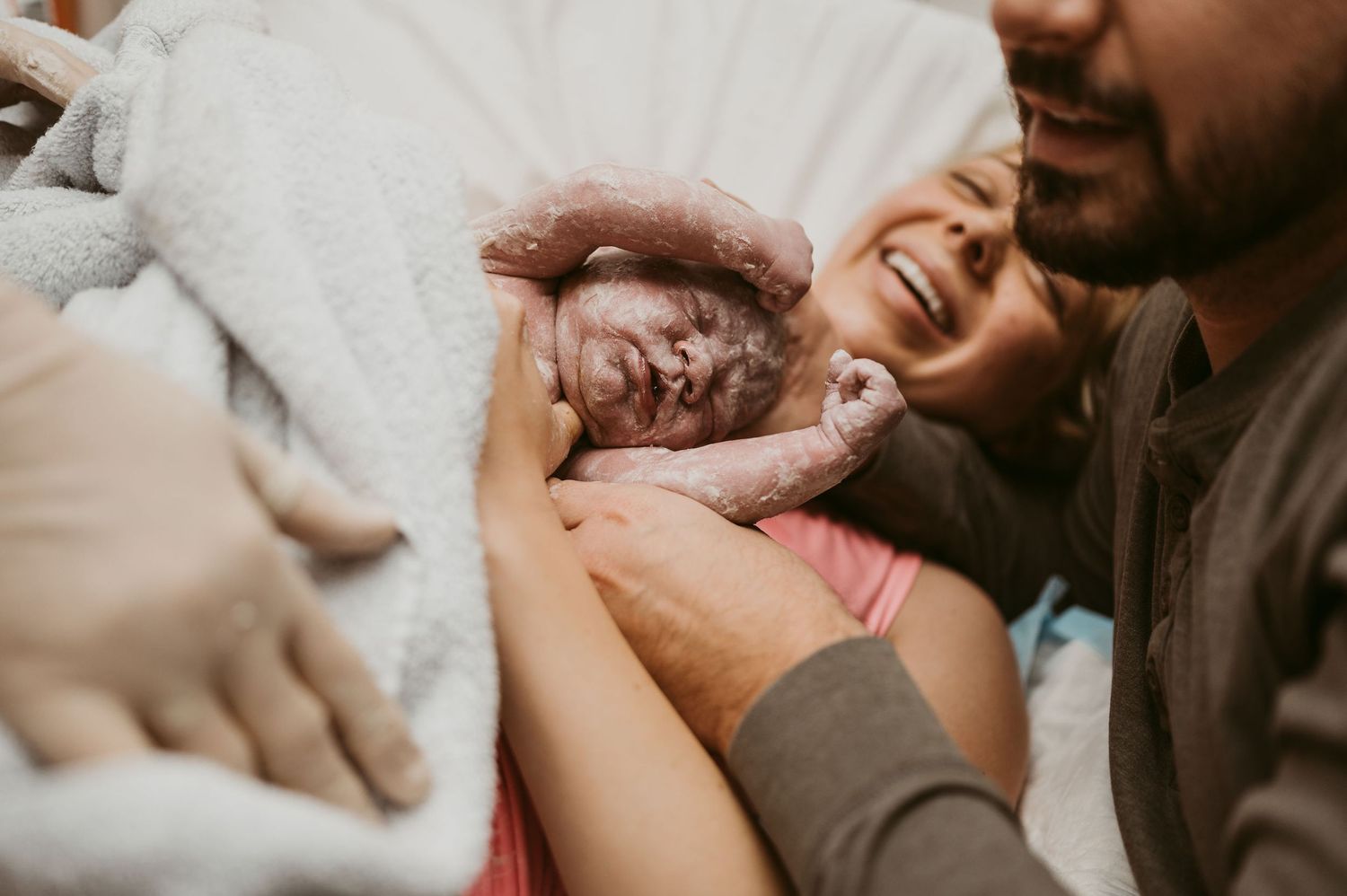 Heartwarming moment of joyful bonding with newborn baby.