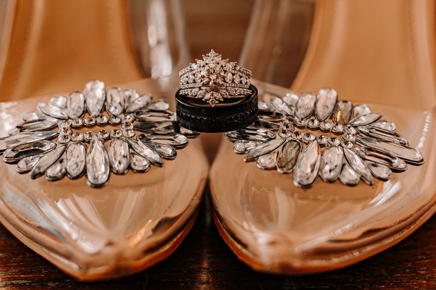 Bridal heels with crystal embellishments displaying diamond engagement ring and wedding band taken by Houston Wedding Photographer.