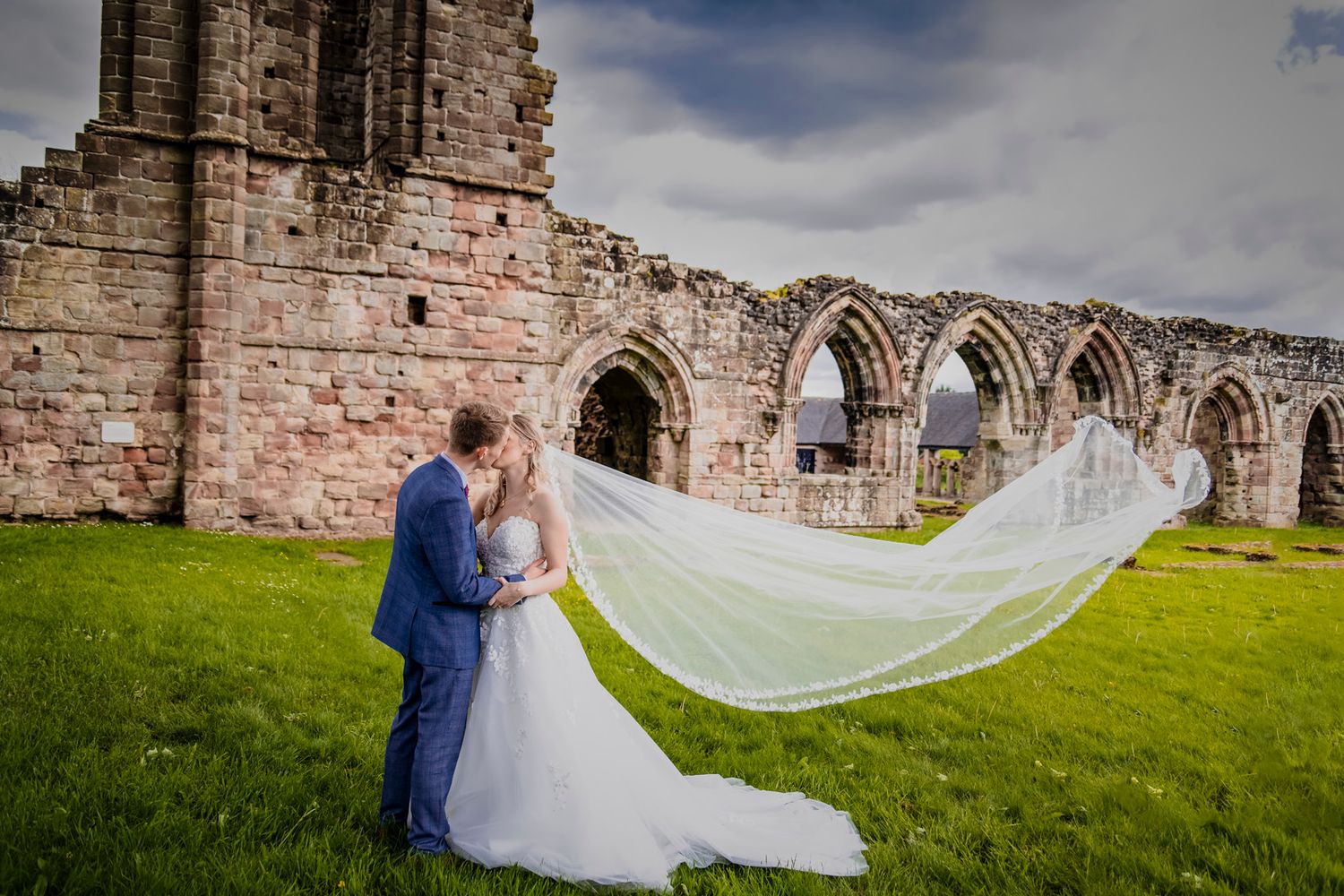 Bride and Groom kiss at their wedding reception in Derbyshire
