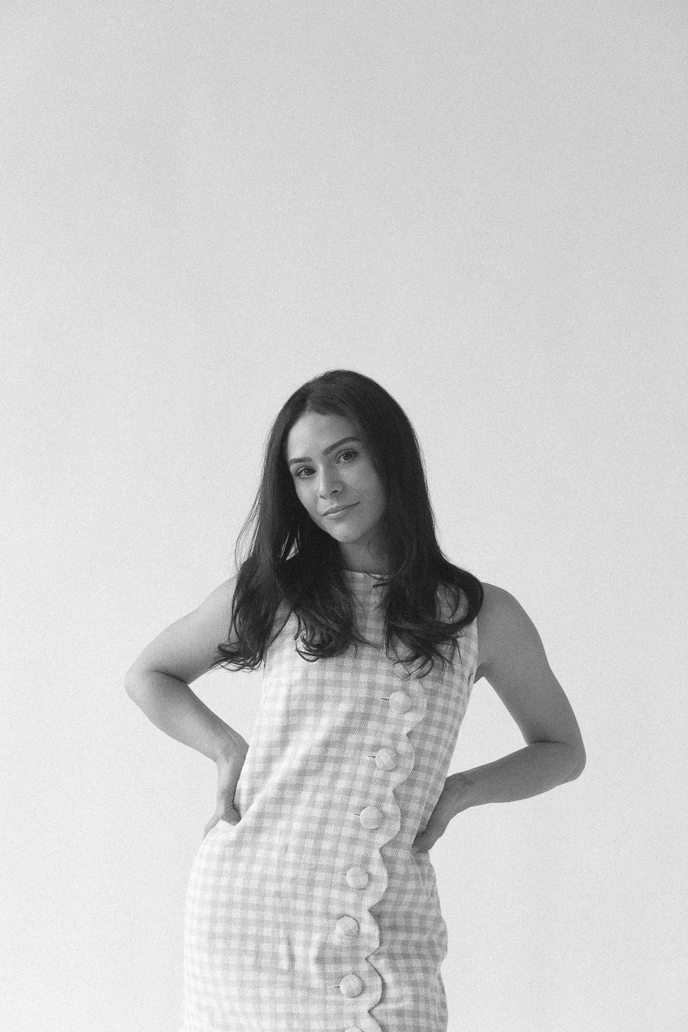 a black and white half body view of Aniella Ernandez during her branding session by Paula Ortiz in NYC