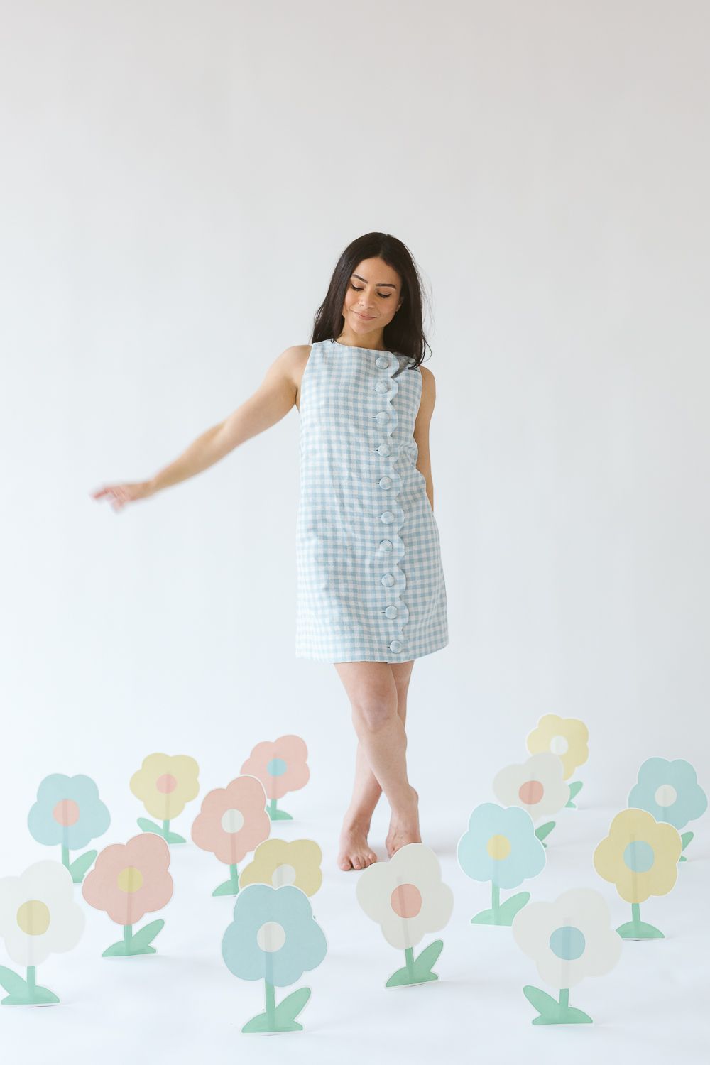 Aniella Ernandez, the artist behind Cosmic Emilia is seen candidly walking amongst her paper flowers in NYC