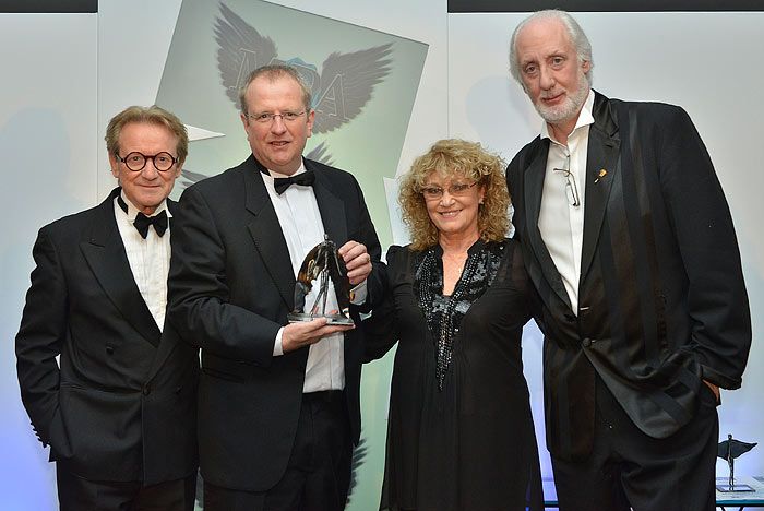 David being presented with an award by John Swannell and Trevor & Faye Yerbury