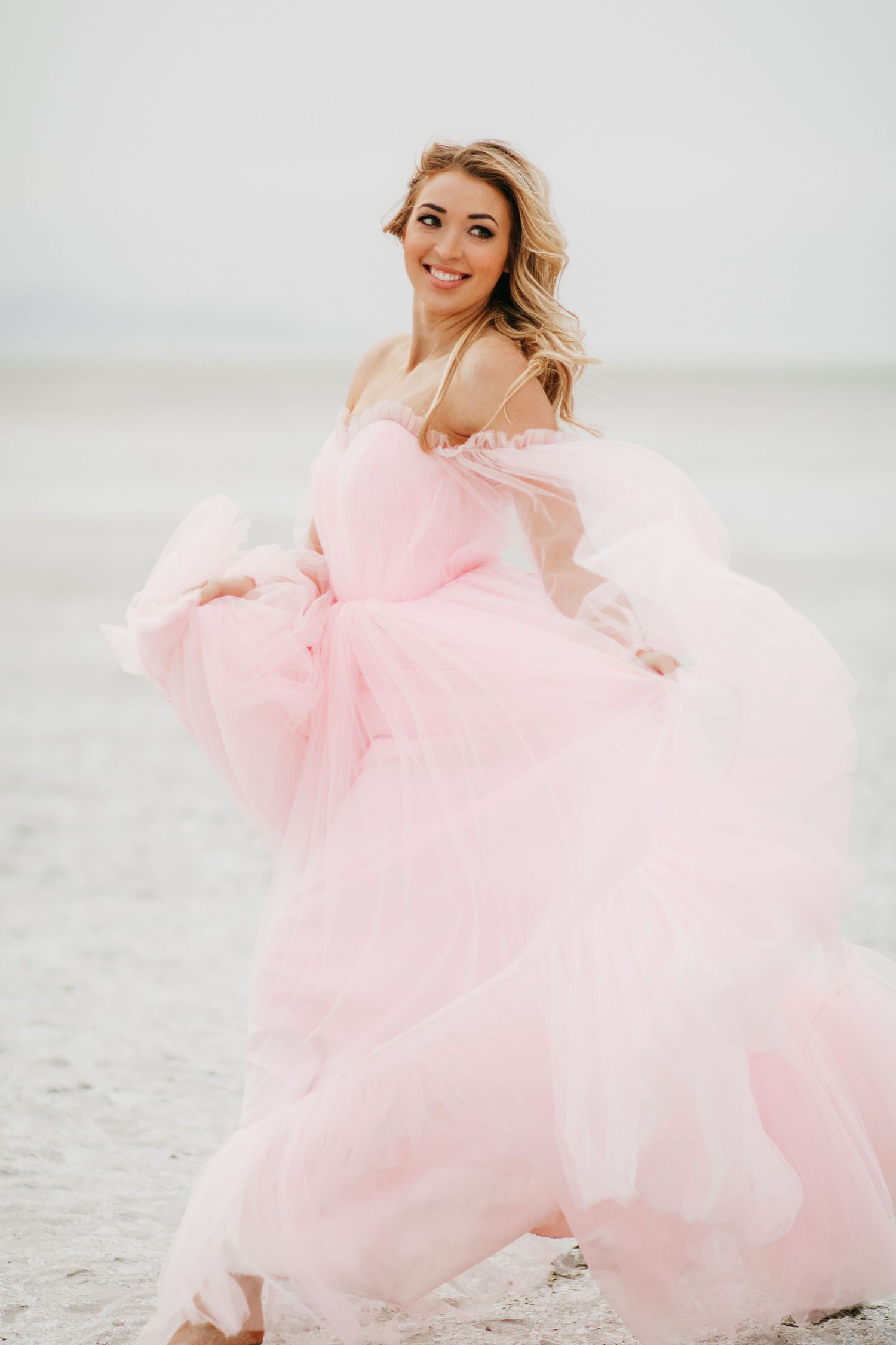 Me running across the sand dunes in a gorgeous dress during a photoshoot I modeled for