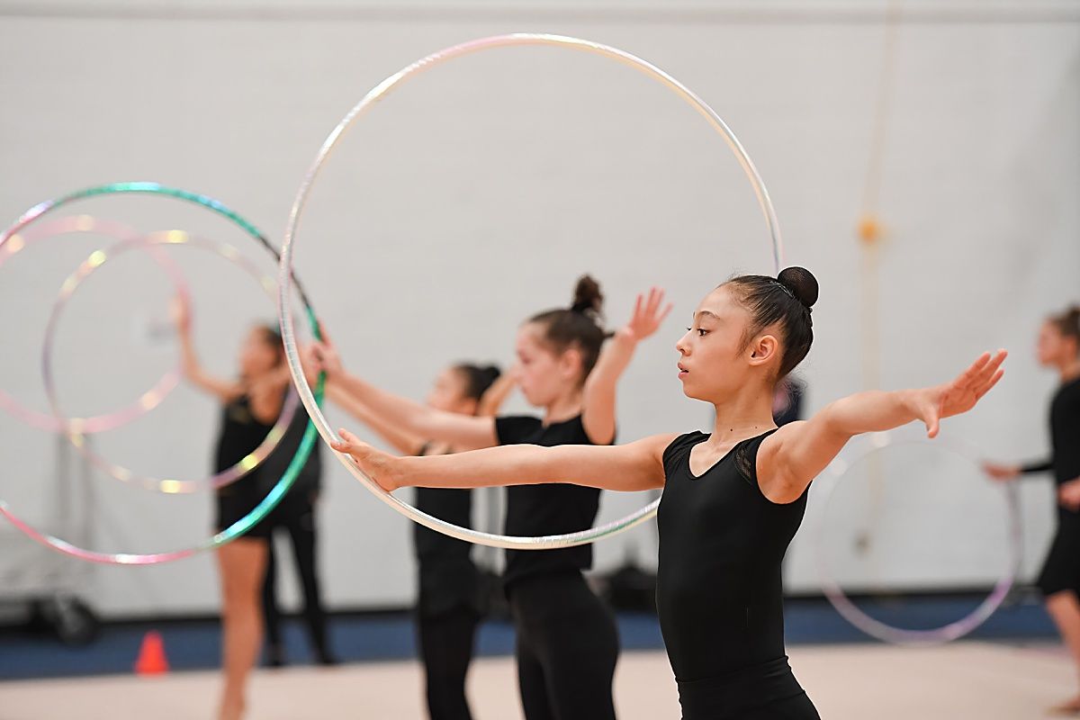 Young gymnast hoop technique