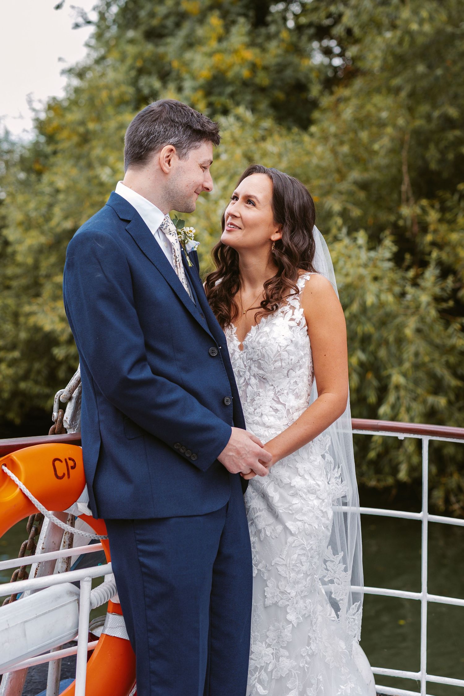 Bride and groom on Caversham boat Thames river UK