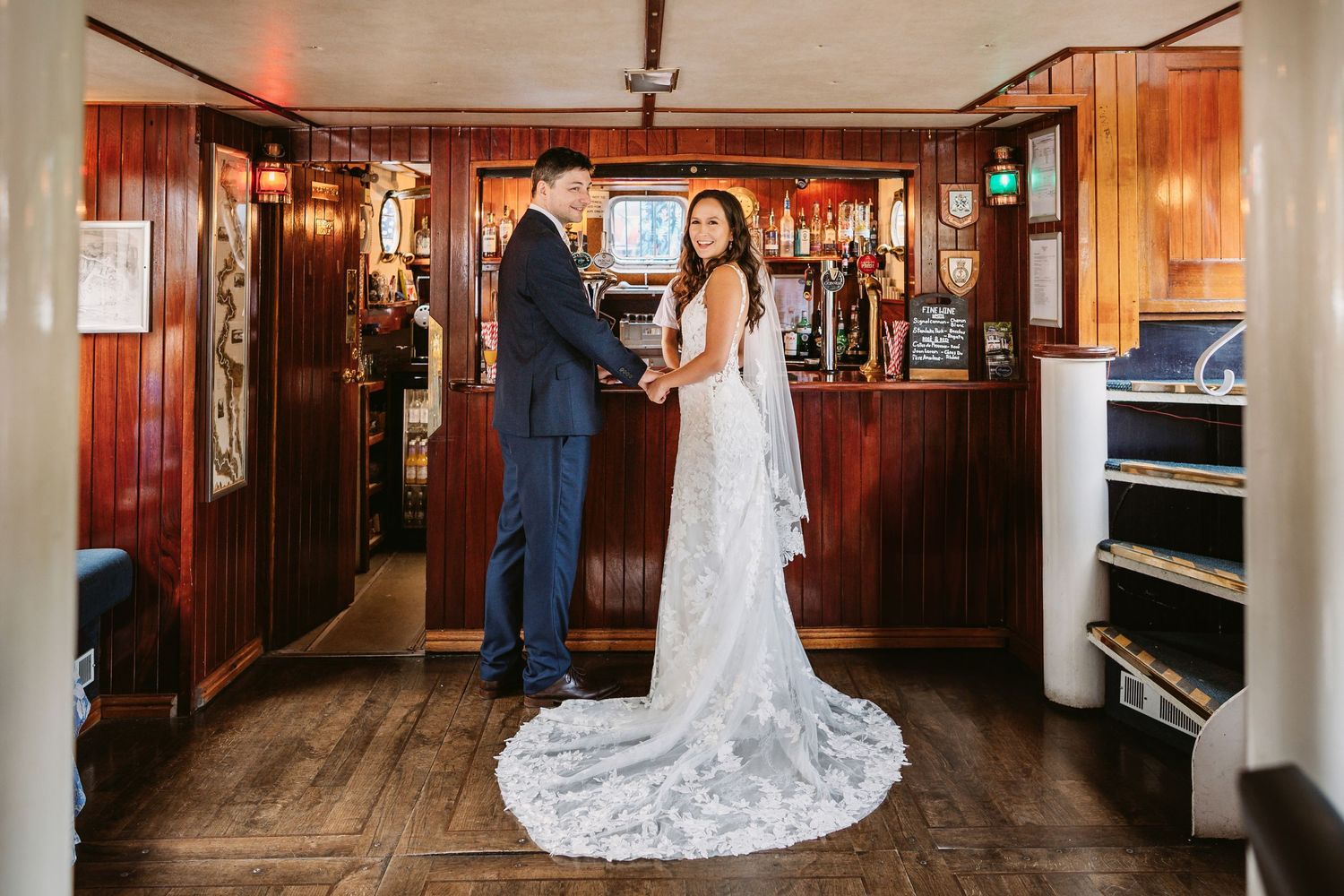 Bride and groom inside below deck Caversham boat Thames river UK
