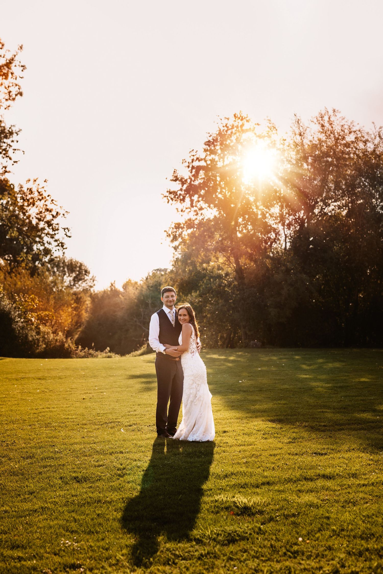 Dancing in golden sunset happy and in love newly weds at Mapledurham wedding venue