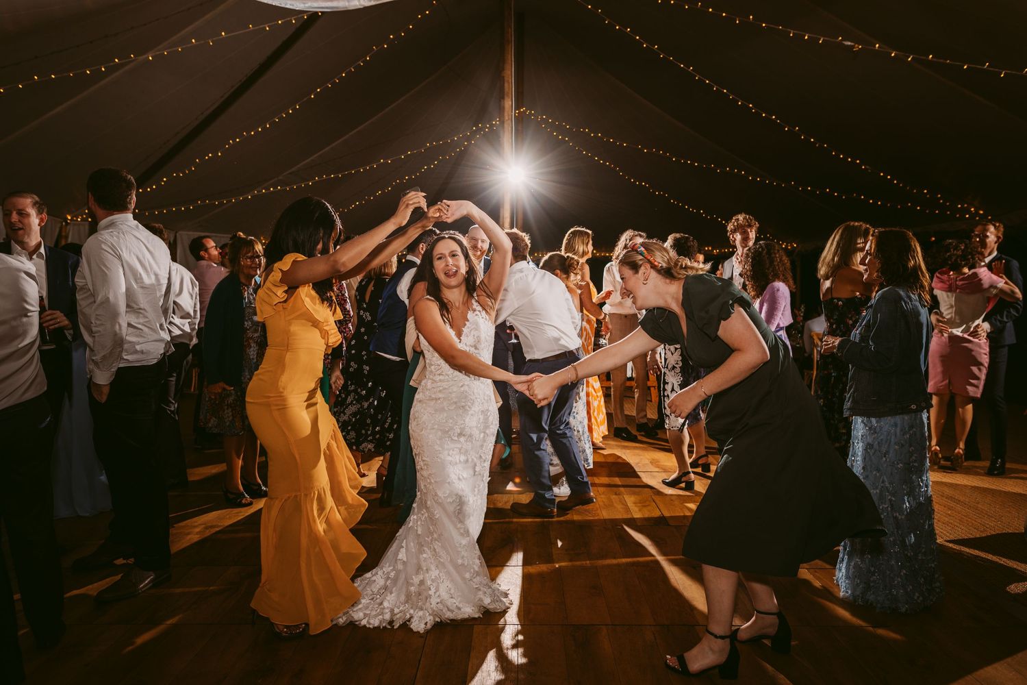 Bride dancing with friends