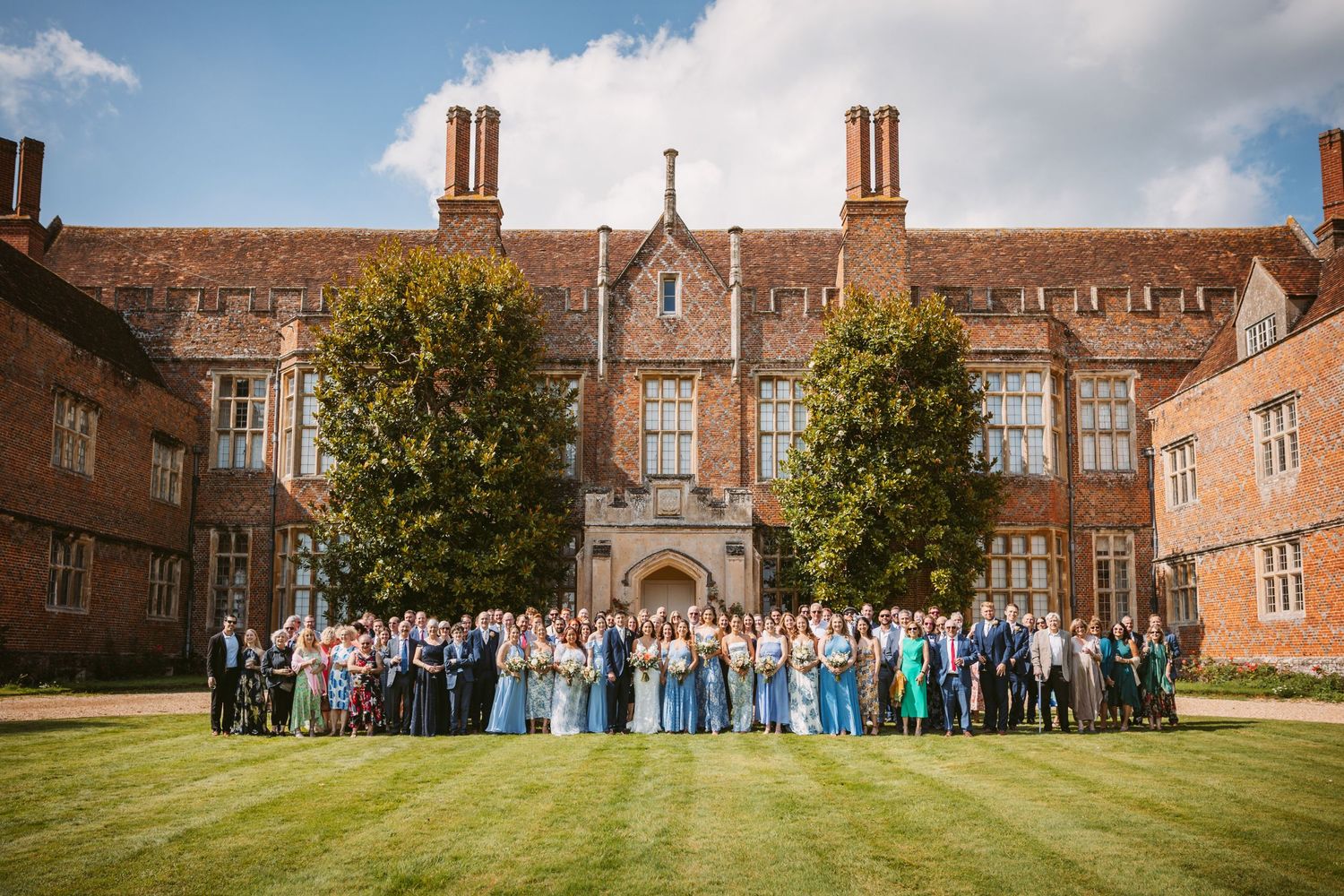 Stunning Mapledurham 12th century home backdrop to wedding group photo