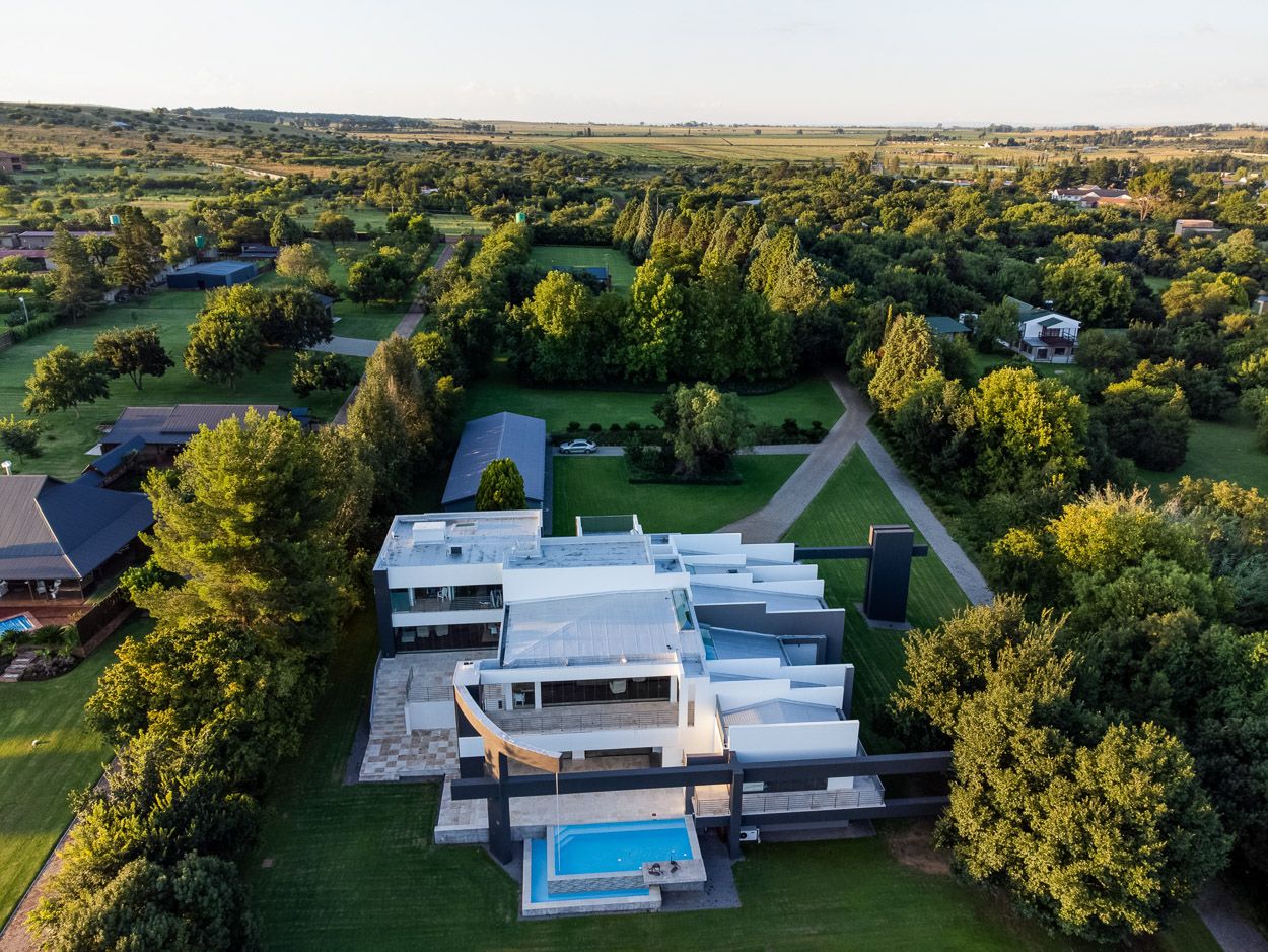 Frontal drone view of a house next to Vaal River