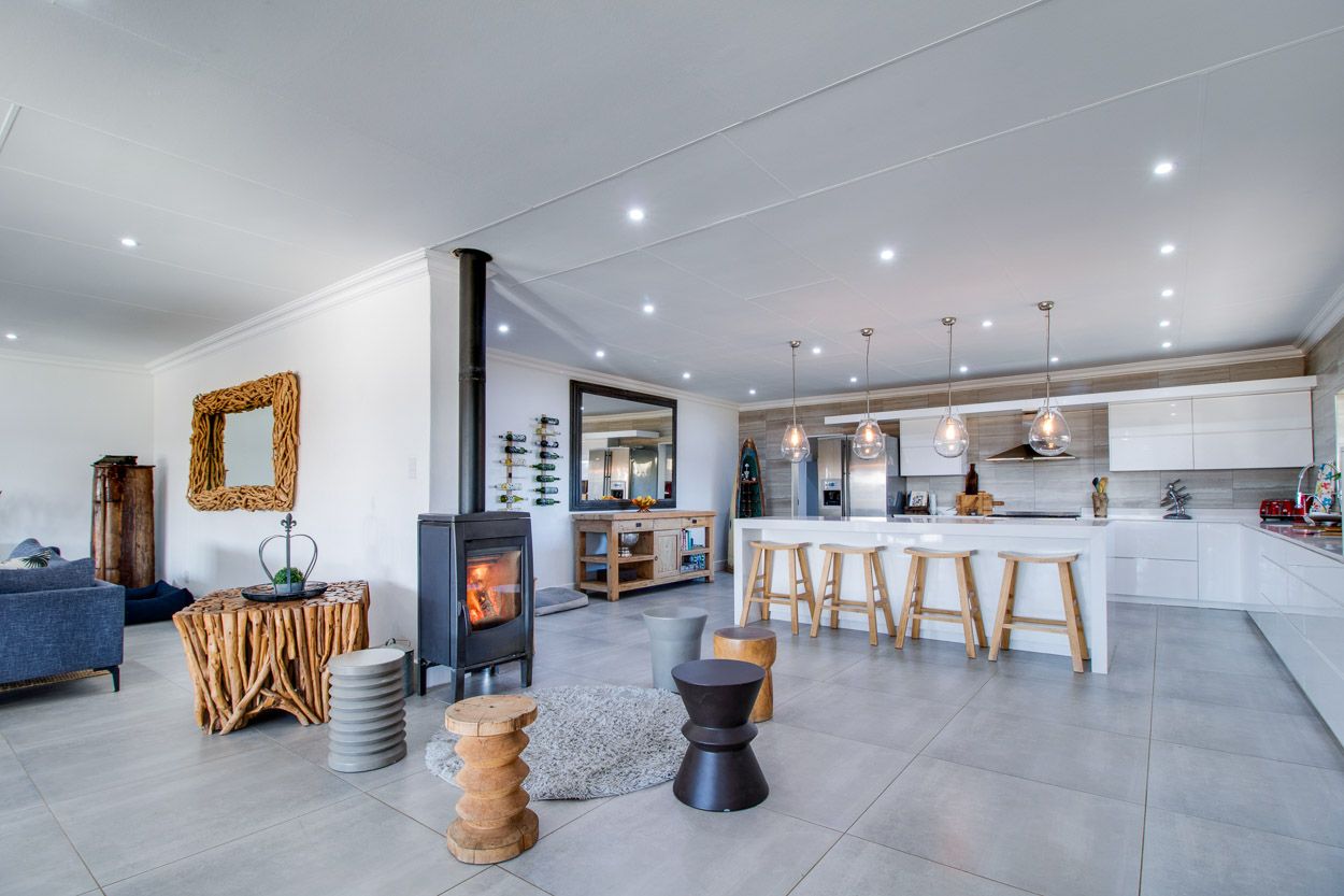 Kitchen and living room with a fire place.