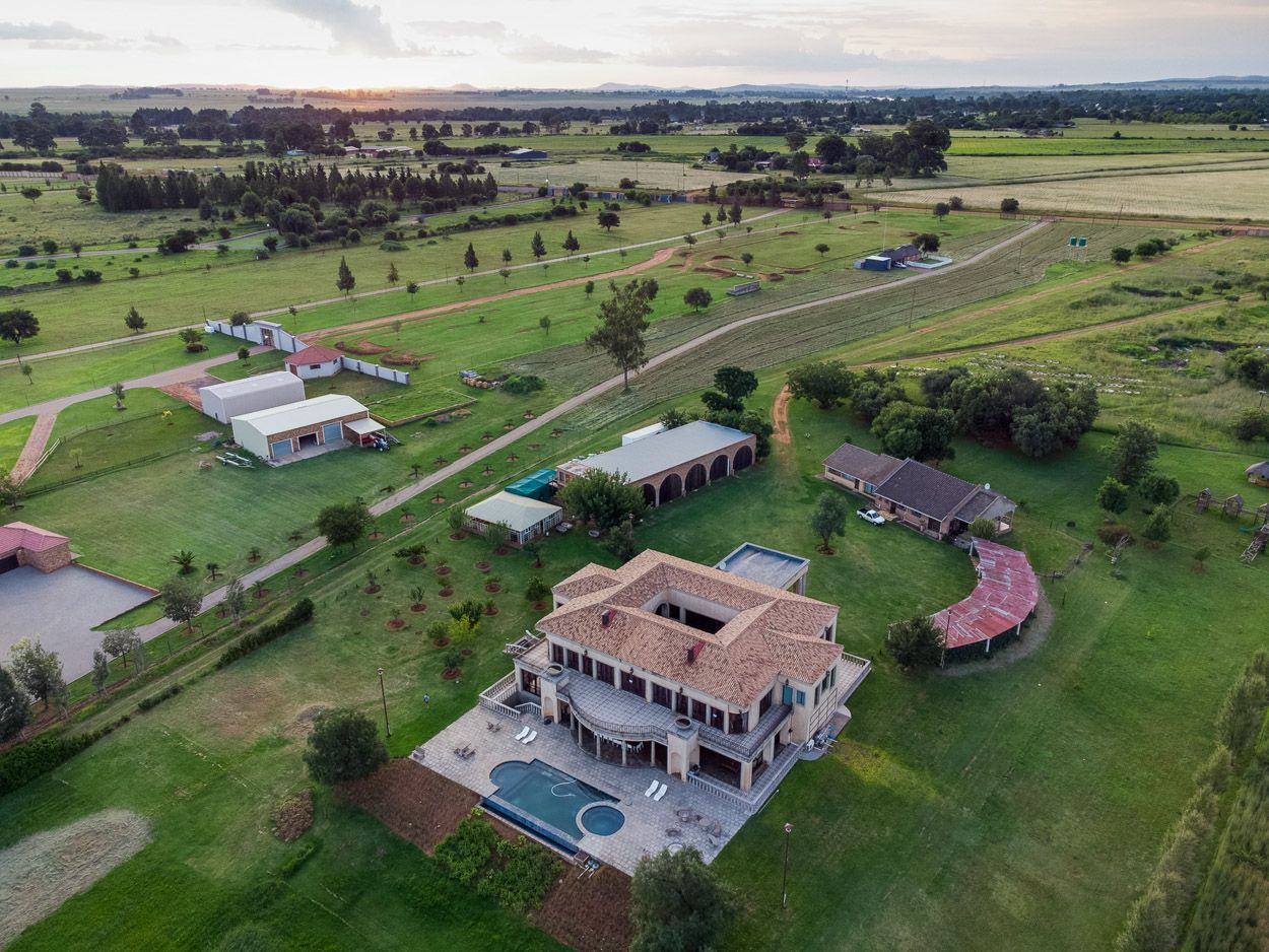 Drone view at sunset of Cuban-styled mansion on Millionaires Bend, next to the Vaal River