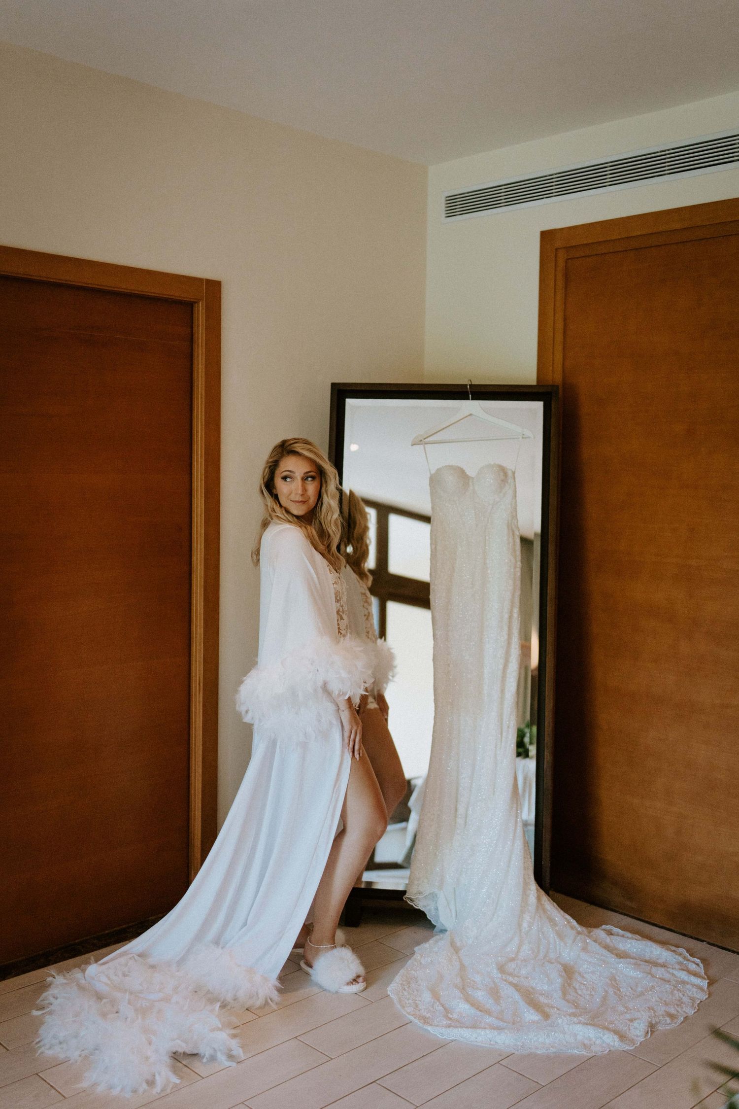 Intimate moments as the bride gets ready, bathed in natural light, at the breathtaking Dreams Las Mareas resort in Costa