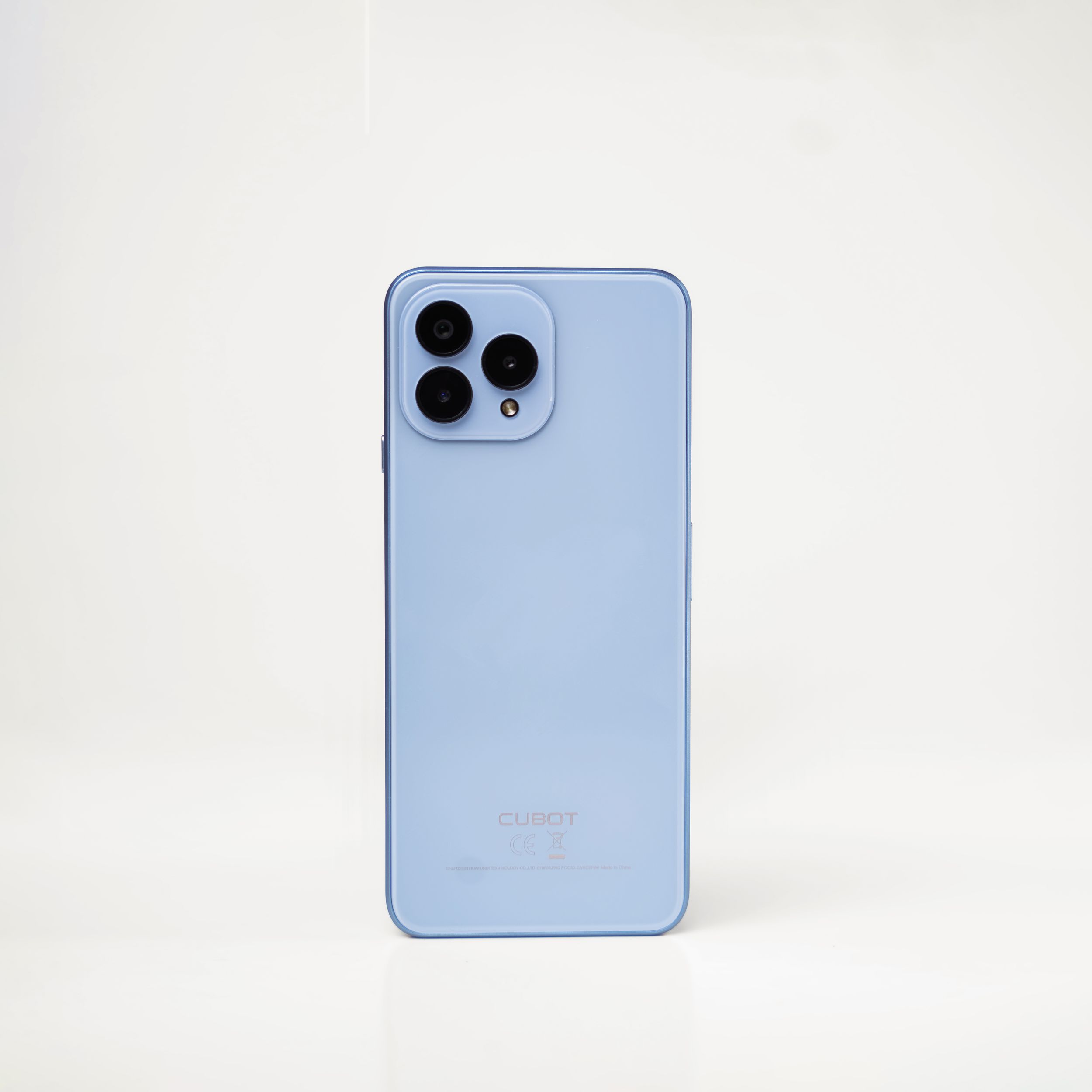 A pastel blue smartphone with triple rear camera array photographed on white background.