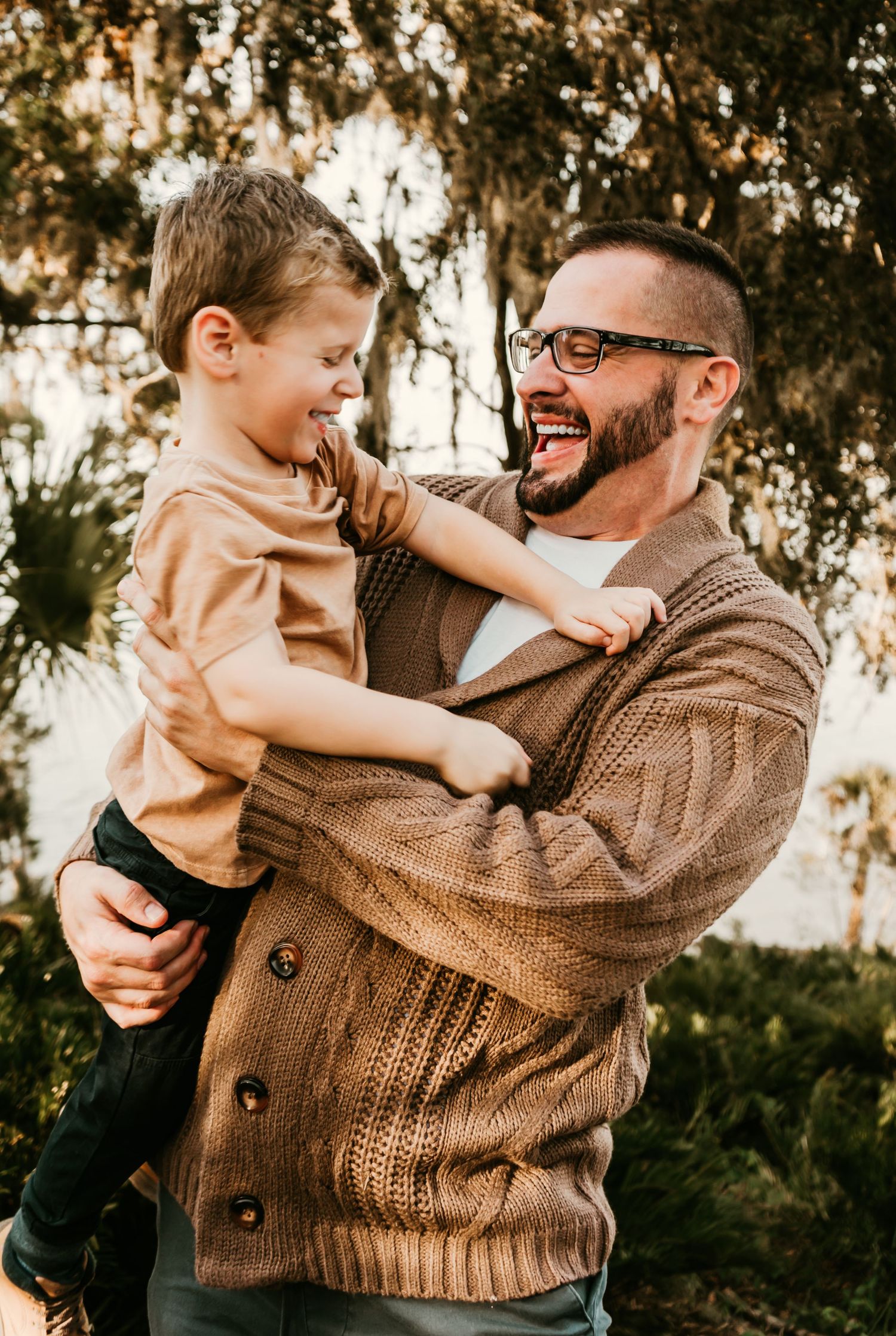 Outdoor Family Session Philippe Park in Safety Harbor, FL; Dad and son playing