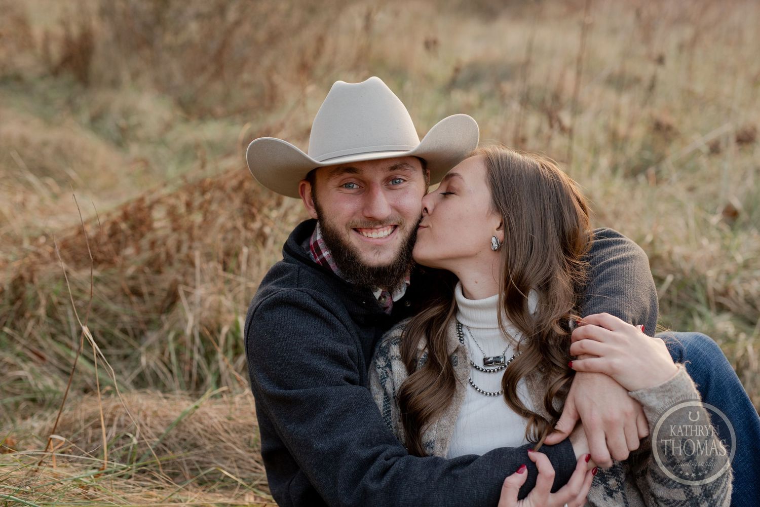 A sweet moment between a couple during their outdoor photoshoot in nature.
