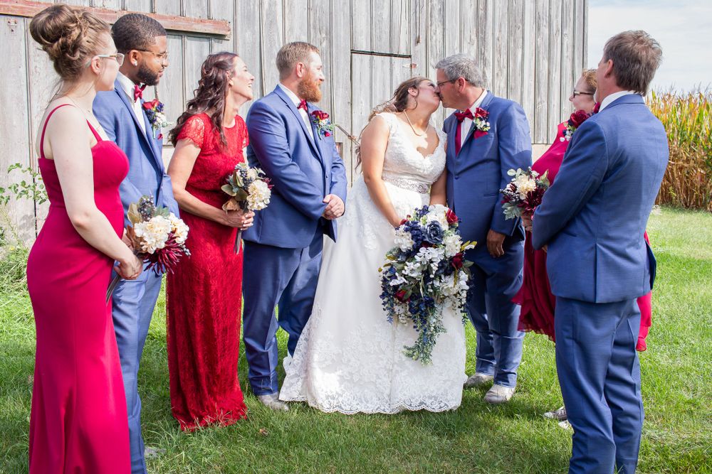 Natural light Wedding party in front of a barn