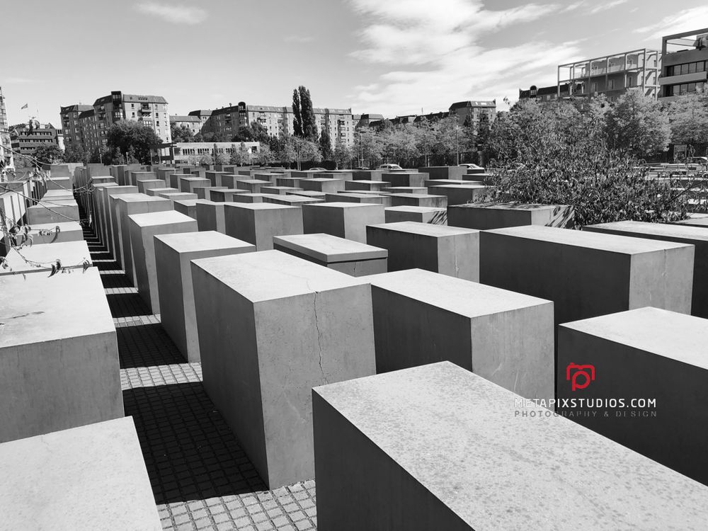 Aerial black and white view of the vast field of concrete blocks at the Holocaust Memorial in Berlin.