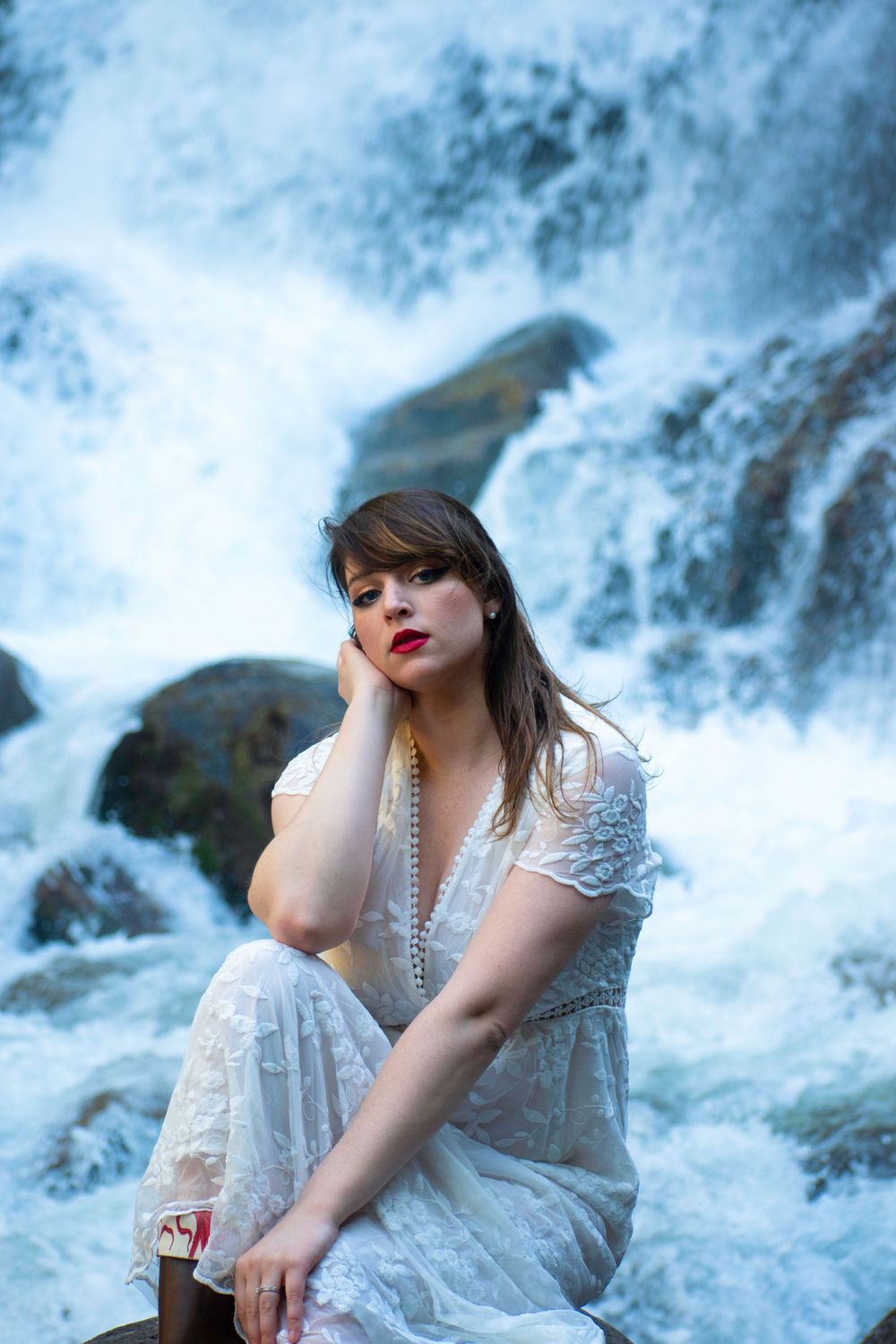 Girl by waterfall
