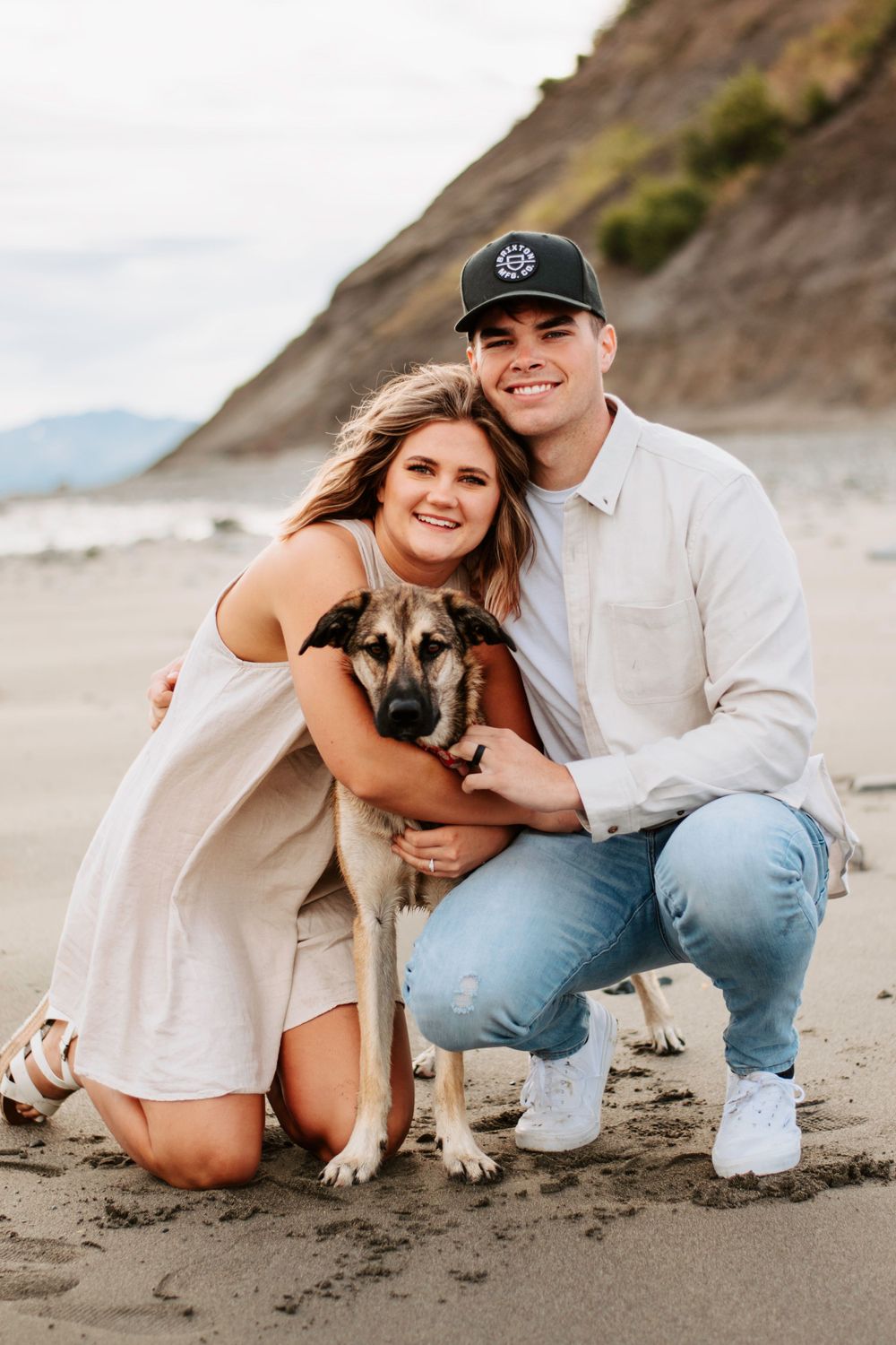 Couple and dog on beach