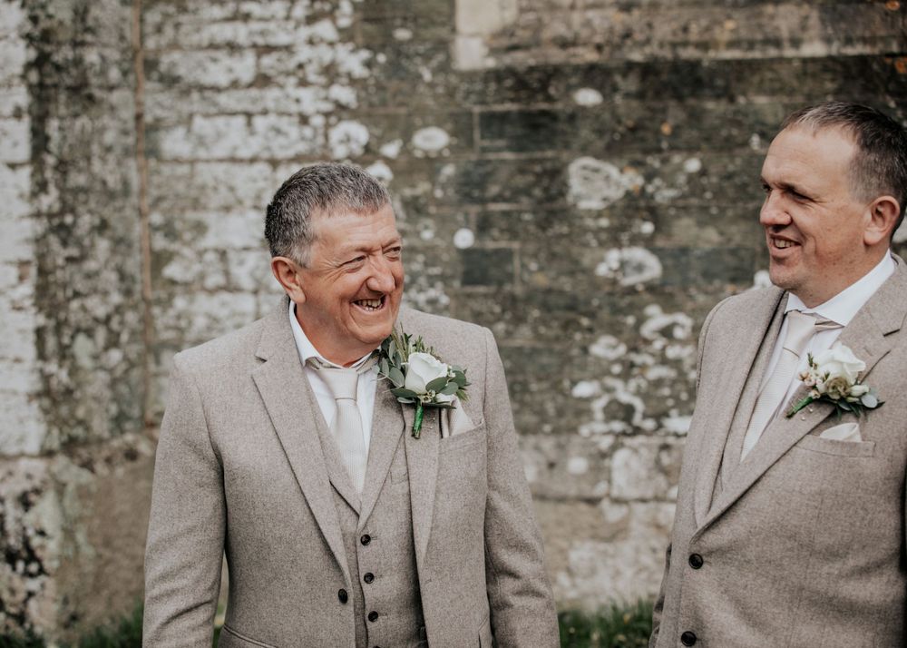 groom and best man waiting outside church photography