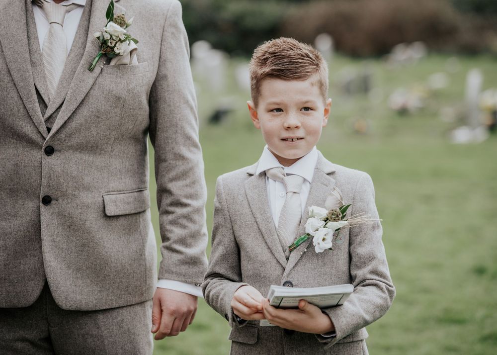 Paige boy handing out order of service photography