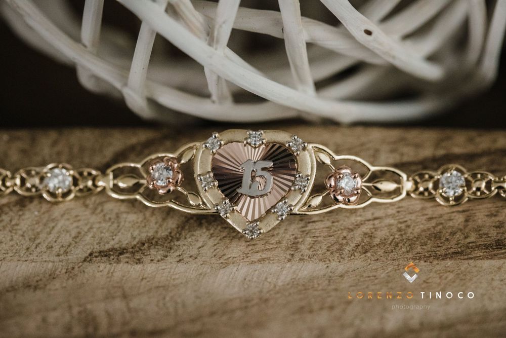 Vintage silver bracelet featuring ornate heart design with crystal embellishments.