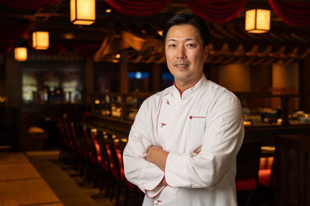 Orlando on-location headshot photographer Ray Alvarez — chef headshot photographed in restaurant with ambient lighting